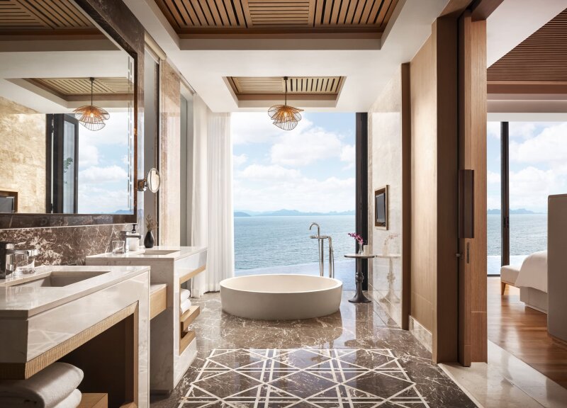 Ocean-view bathroom with freestanding bathtub at Conrad Koh Samui.