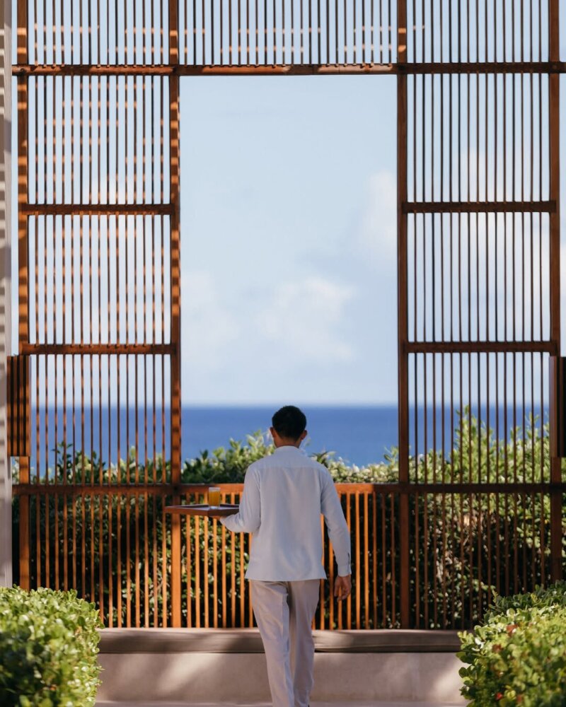 Waiter walking with tray.
