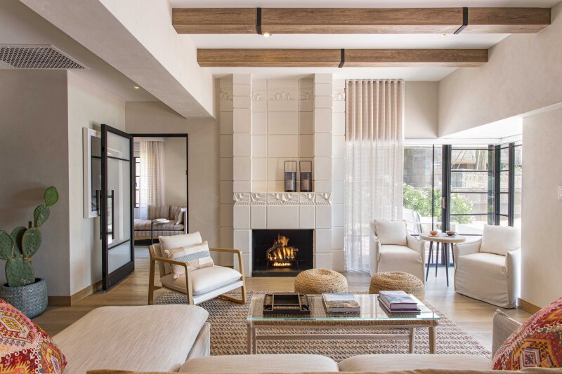 Bright suite living room with fireplace at Arizona Biltmore, LXR Hotels & Resorts.