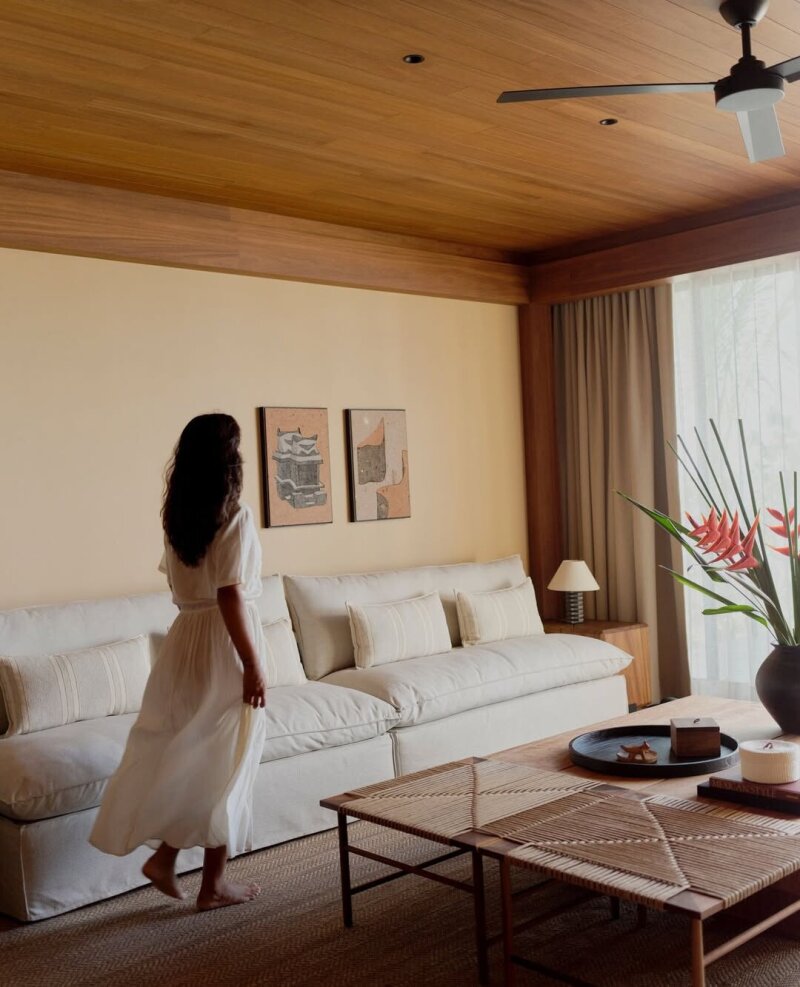 Woman walking in living room.
